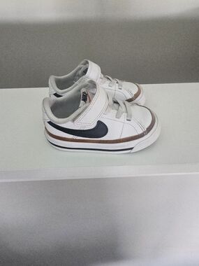 Nike Kids White Sneakers with Black Swoosh and Brown Accent